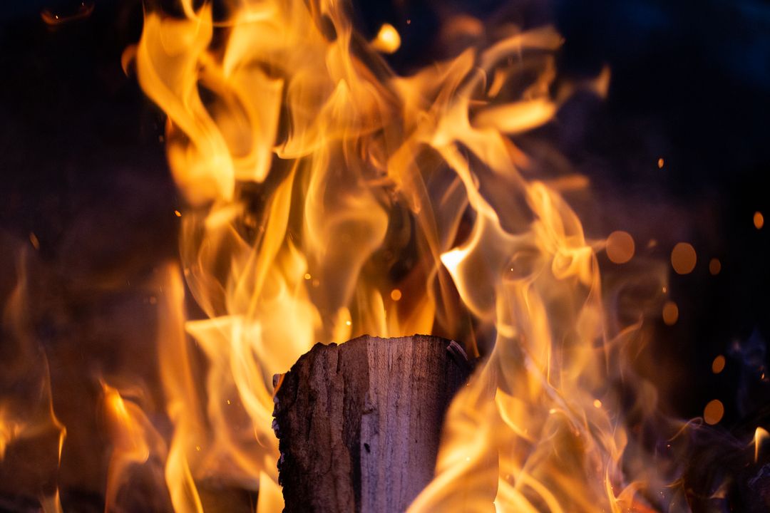Fiery Flames Engulfing Log in Intense Heat