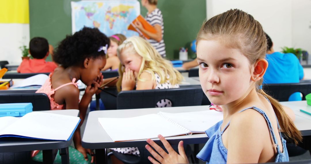Young Schoolgirl Sitting During Classroom Discussion