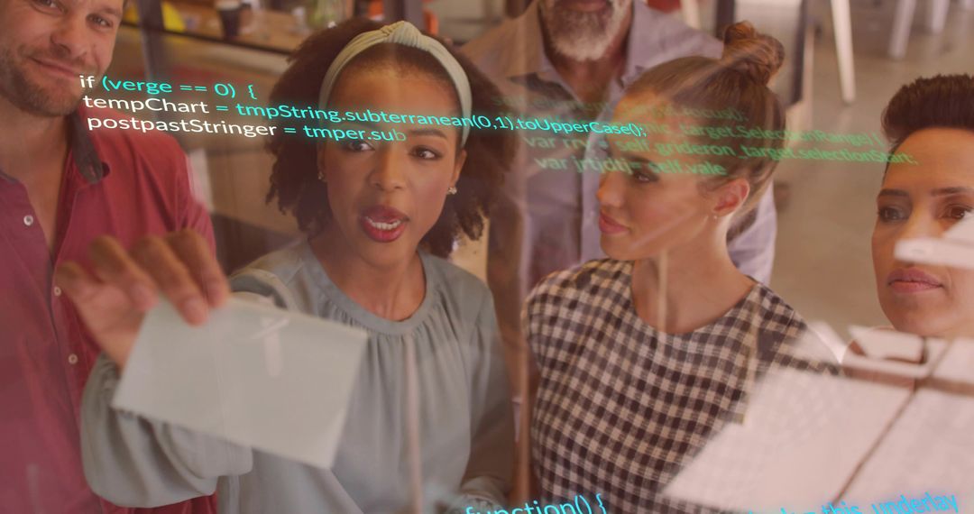 Team Collaborating with Transparent Board and Code Overlay in Office