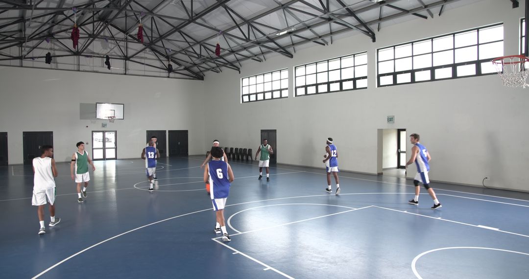 High School Basketball Team Practicing in Gymnasium
