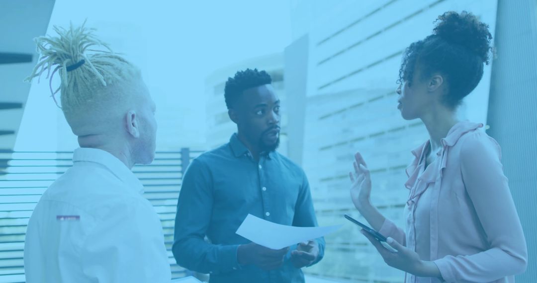 Team Discussing Ideas in Modern Office Lobby