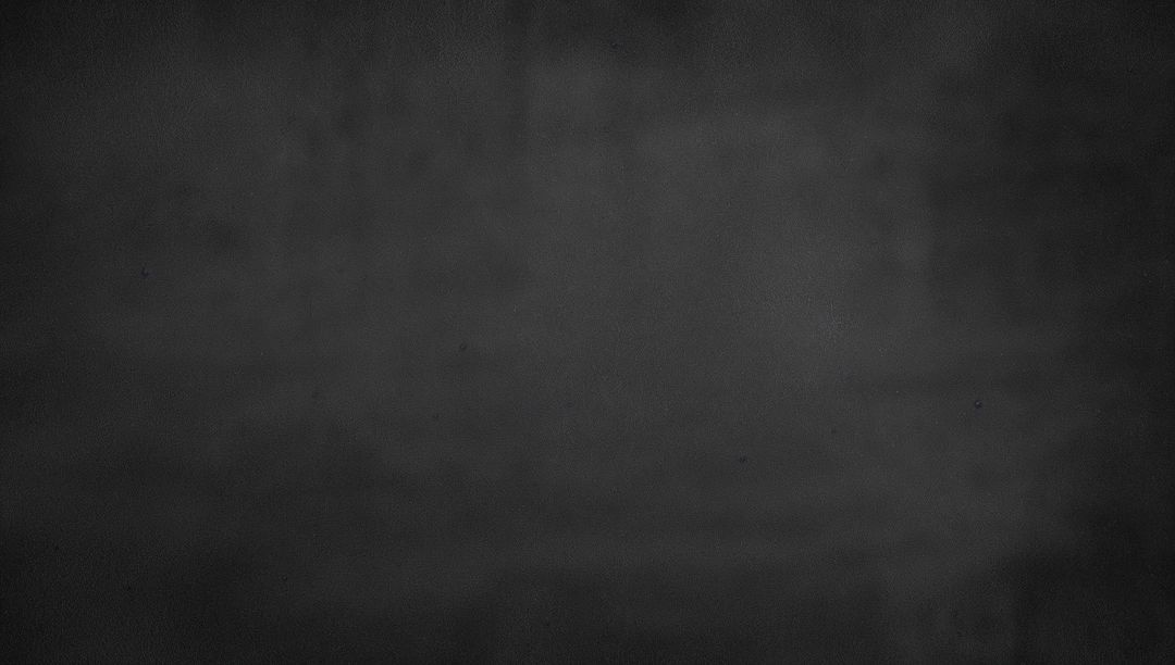 Charcoal Textured Backdrop Showing Subtle Vignette and Grainy Concrete Surface