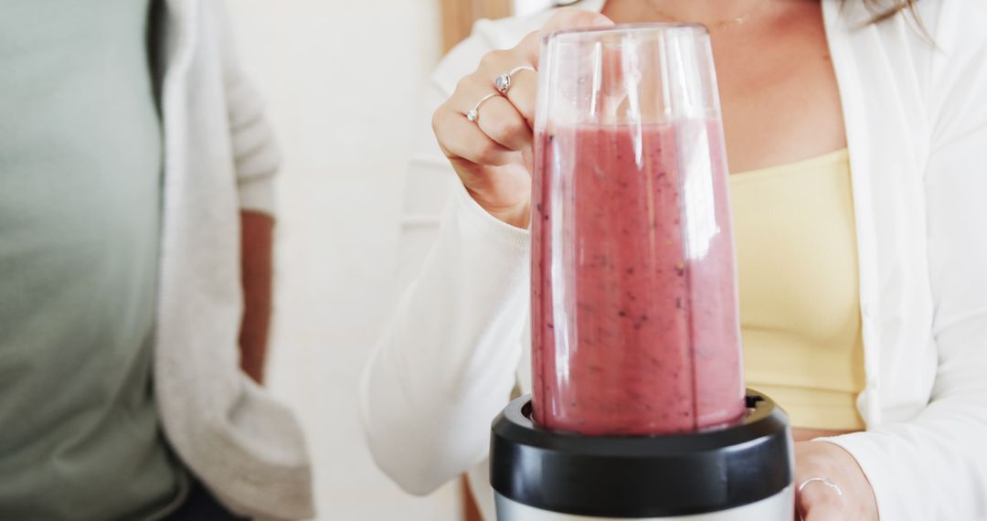 Woman Blending Fresh Fruit Smoothie in Kitchen - Free Images, Stock Photos and Pictures on Pikwizard.com