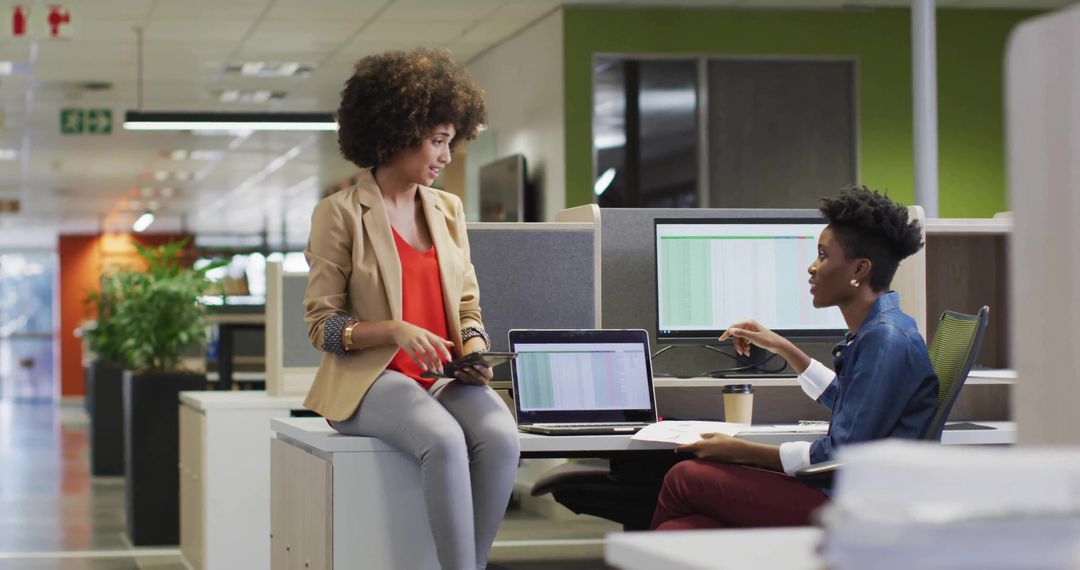 Collaborative Colleagues Reviewing Data Techniques in Modern Office