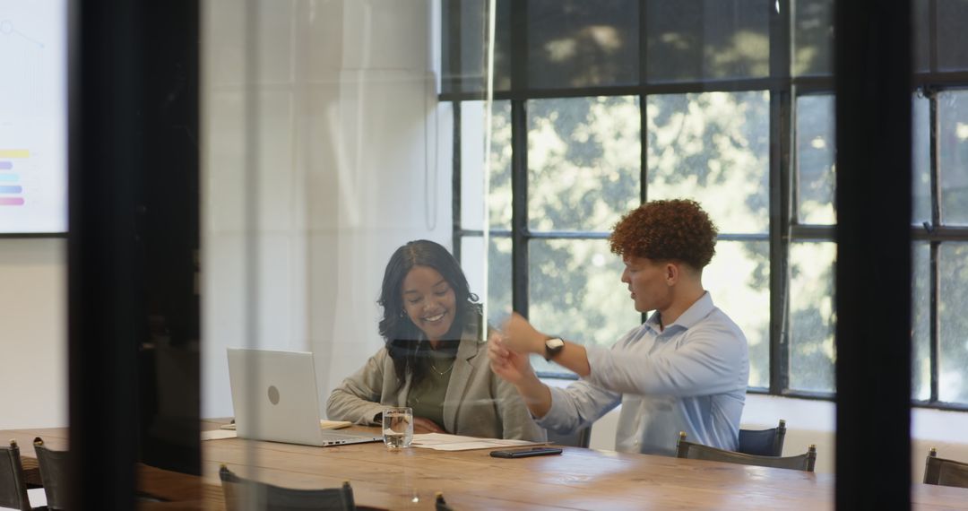 Diverse Colleagues Engaging in Strategy Meeting in Modern Office