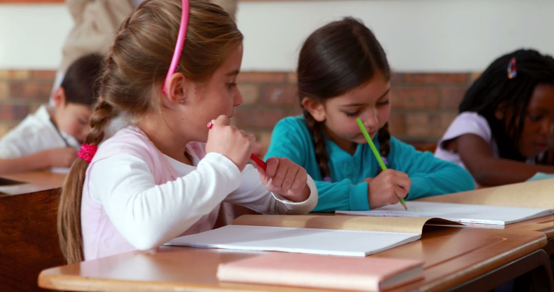 Young Students Writing in Classroom Setting - Free Images, Stock Photos and Pictures on Pikwizard.com