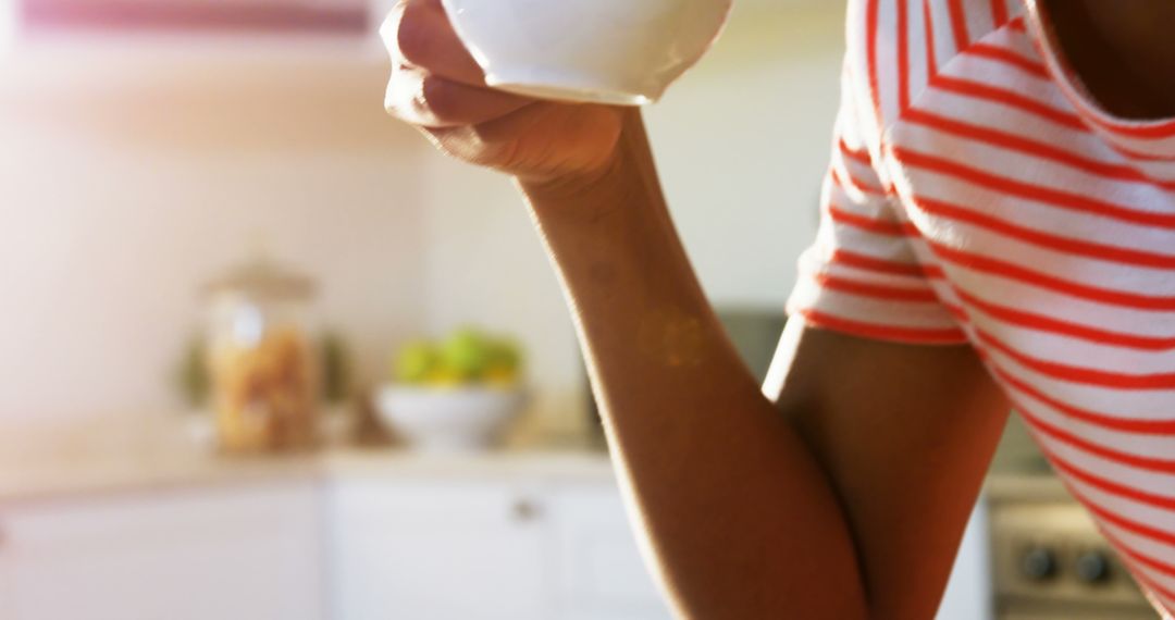 Person Holding Morning Coffee Cup in Kitchen - Free Images, Stock Photos and Pictures on Pikwizard.com