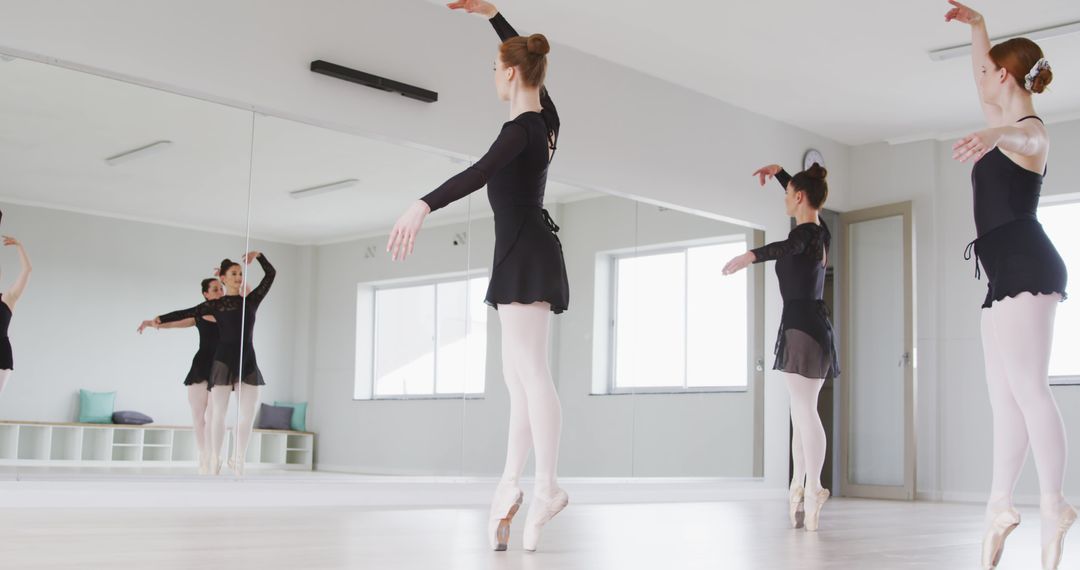 Group of ballet dancers practicing in studio with mirrors - Free Images, Stock Photos and Pictures on Pikwizard.com
