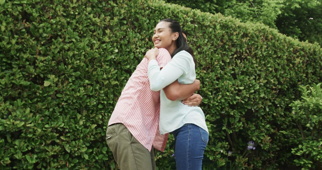 Couple Joyously Embracing in Serene Garden