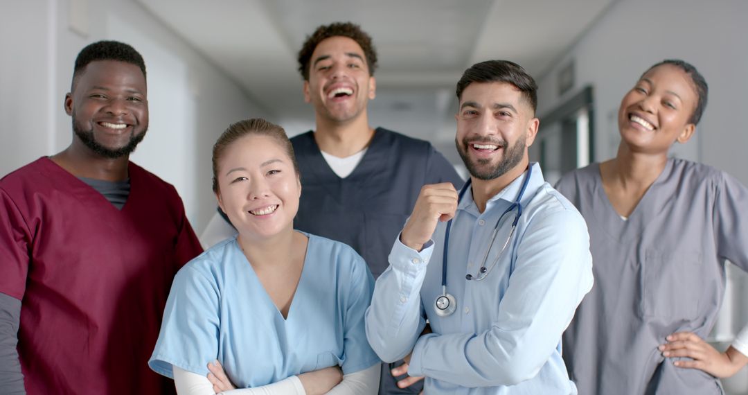 Diverse Medical Team Proudly Posing in Hospital Corridor