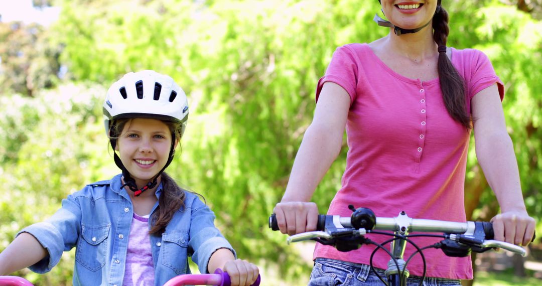 Mother and Daughter Biking Outdoors on a Sunny Day - Free Images, Stock Photos and Pictures on Pikwizard.com