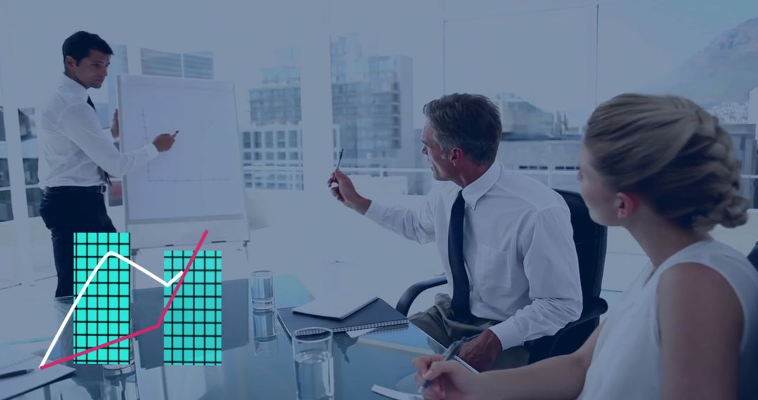 Colleagues Discussing Strategy with Graphs in Office