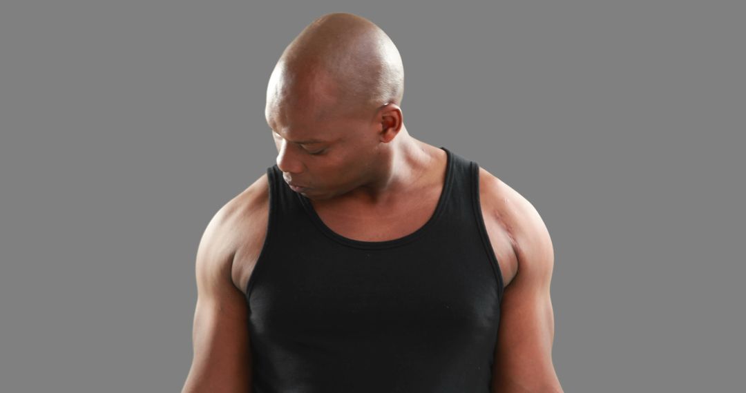 Strong African American Man Wearing Black Tank Top - Free Images, Stock Photos and Pictures on Pikwizard.com