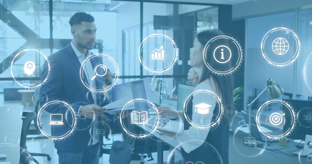 Coworkers Sharing Ideas in Modern Tech-Driven Office Environment