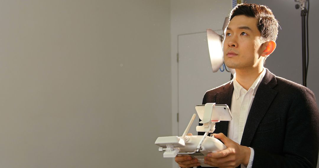 Photographer Piloting Drone in Studio Environment