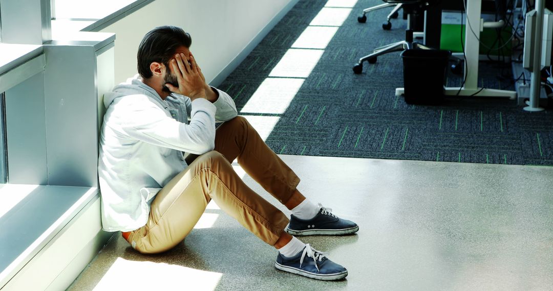 Frustrated Office Worker Sitting on Floor Covering Face with Hands - Free Images, Stock Photos and Pictures on Pikwizard.com