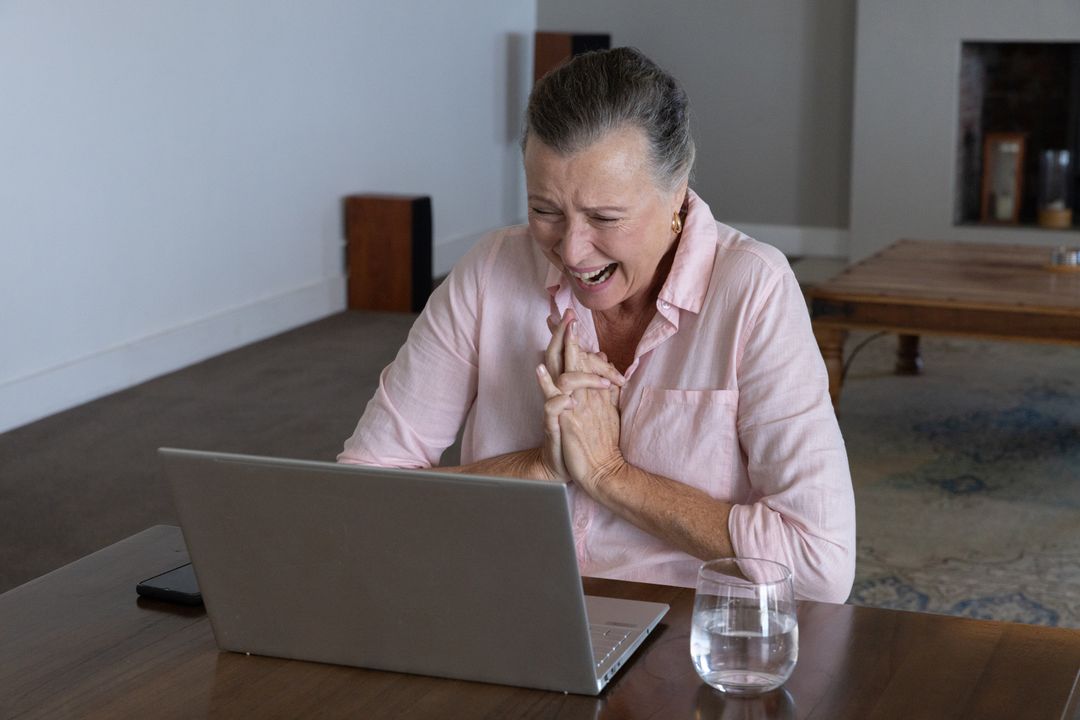 Happy Senior Woman Engaging Online from Cozy Home