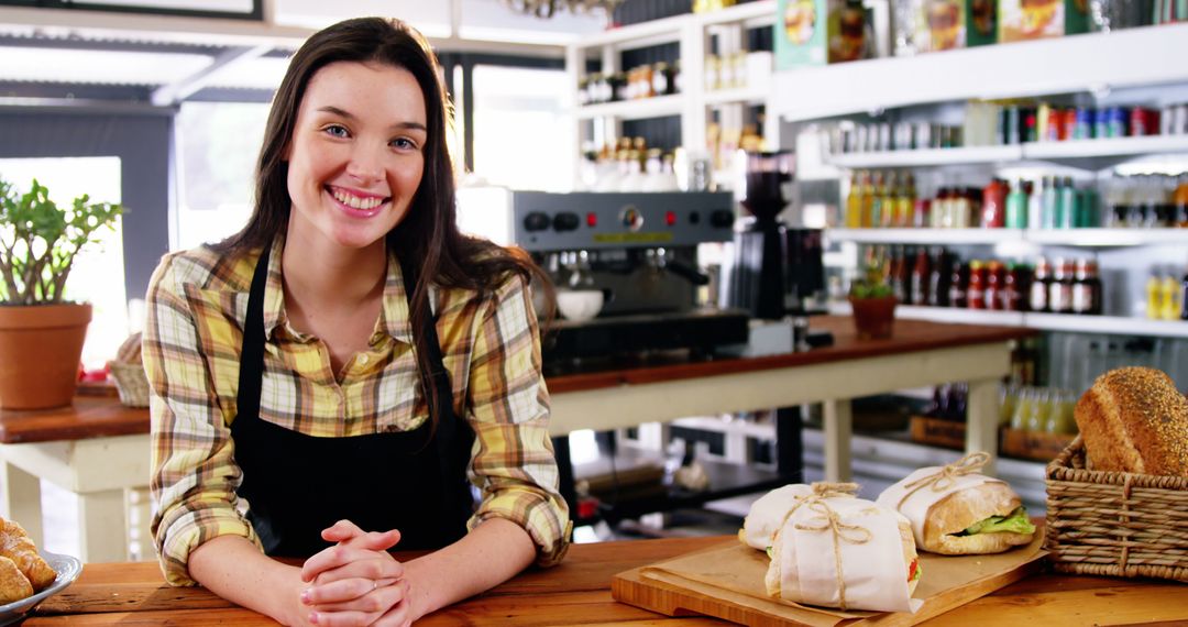 Friendly Barista Smiling in Cozy Cafe - Free Images, Stock Photos and Pictures on Pikwizard.com