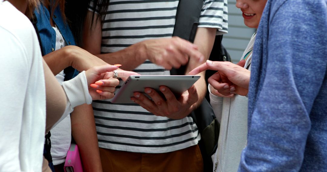 Group of Friends Discussing Over Tablet - Free Images, Stock Photos and Pictures on Pikwizard.com