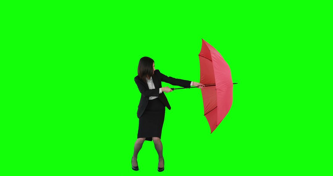 Businesswoman Navigating Wind with Red Umbrella on Green Background - Free Images, Stock Photos and Pictures on Pikwizard.com