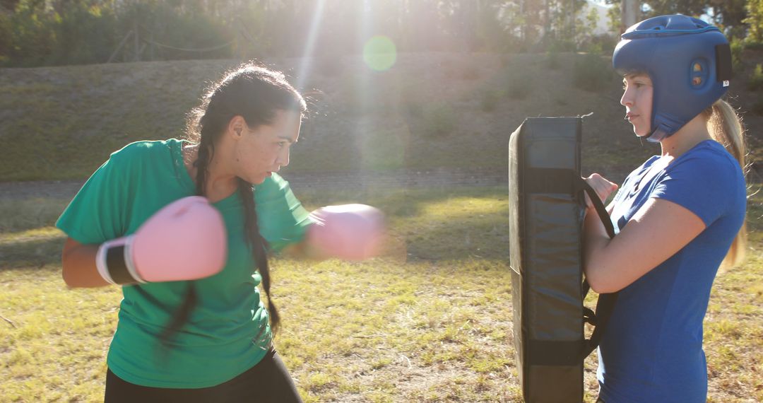 Women Practicing Boxing Outdoors with Training Gear - Free Images, Stock Photos and Pictures on Pikwizard.com