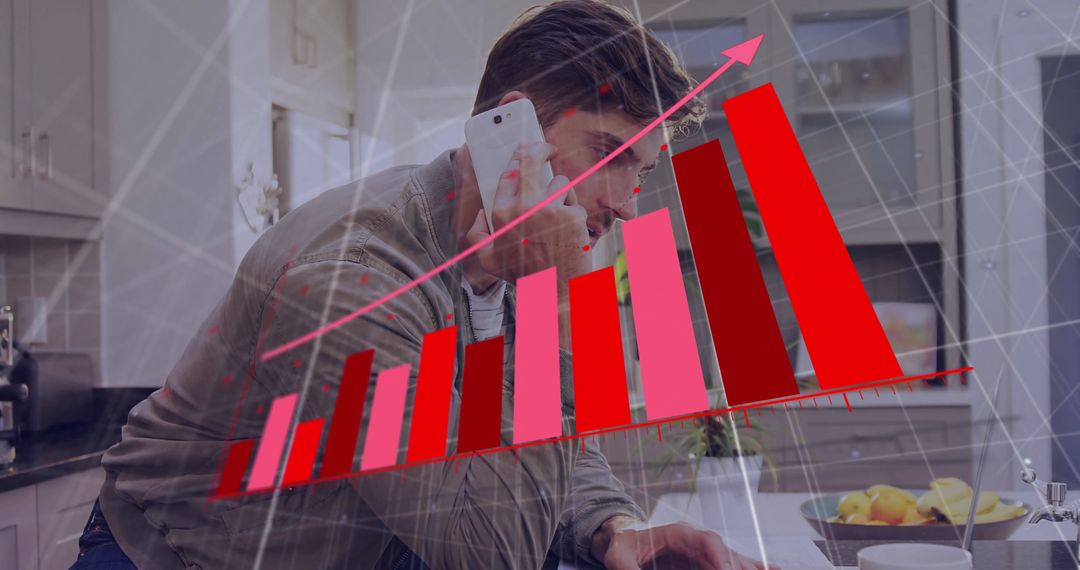 Businessman Analyzing Financial Data on Laptop in Modern Kitchen