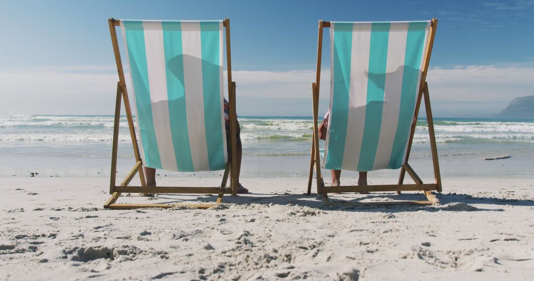 Two People Relaxing in Beach Chairs on a Sunny Day - Free Images, Stock Photos and Pictures on Pikwizard.com