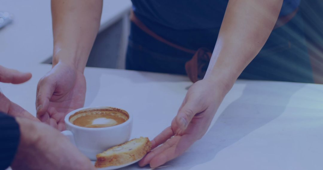 Barista Serving Freshly Brewed Coffee with Biscuit