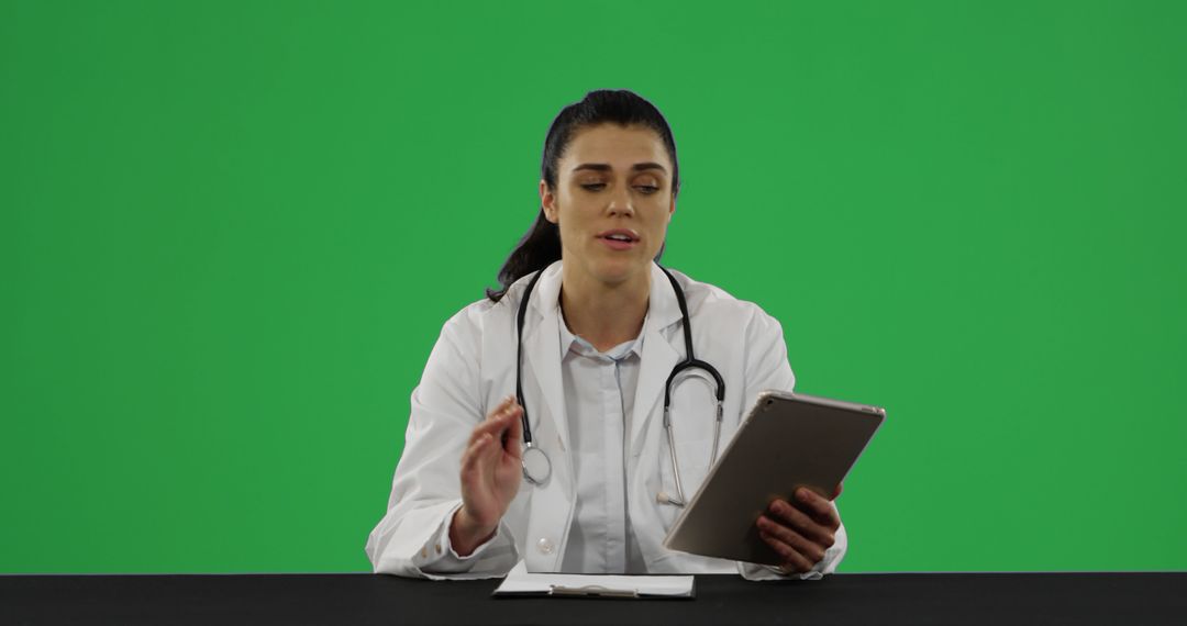 Female Doctor Working with Digital Tablet on Virtual Green Screen - Free Images, Stock Photos and Pictures on Pikwizard.com