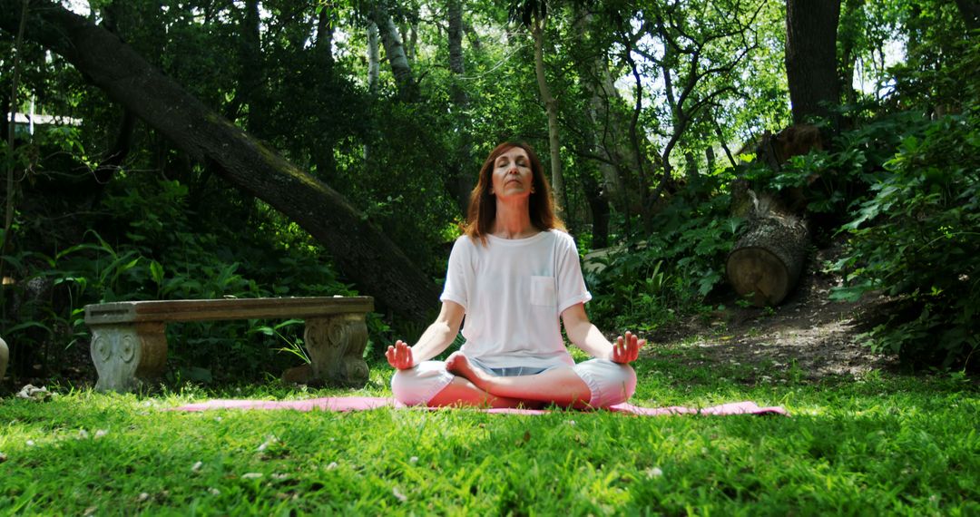 Woman Practicing Meditation Outdoors in Lush Green Forest - Free Images, Stock Photos and Pictures on Pikwizard.com