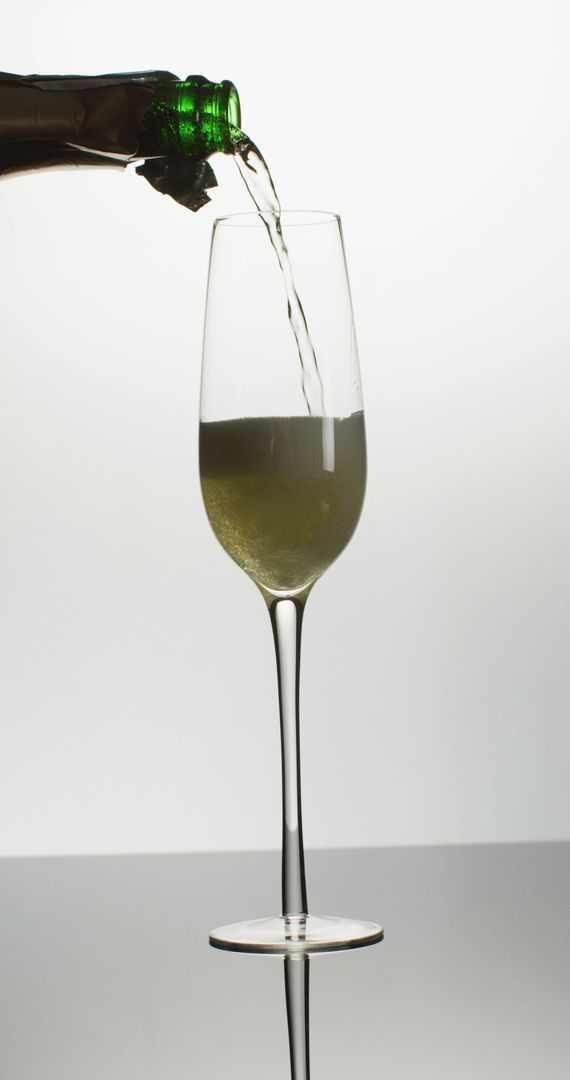 Champagne Pouring into Elegantly Designed Tulip Glass
