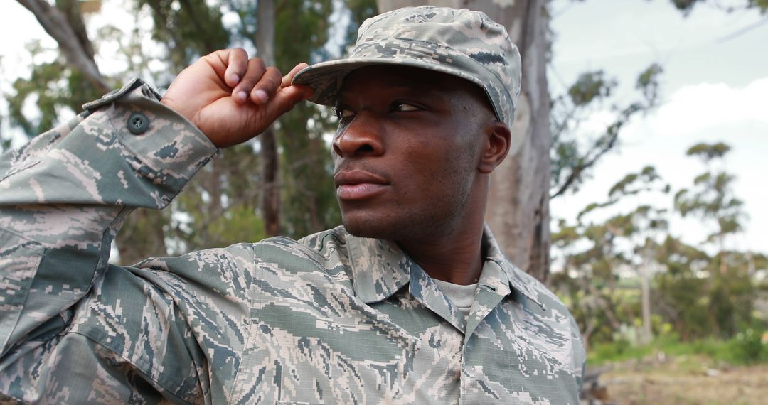 Confident Armed Forces Soldier in Camouflage Uniform Outdoors - Free Images, Stock Photos and Pictures on Pikwizard.com