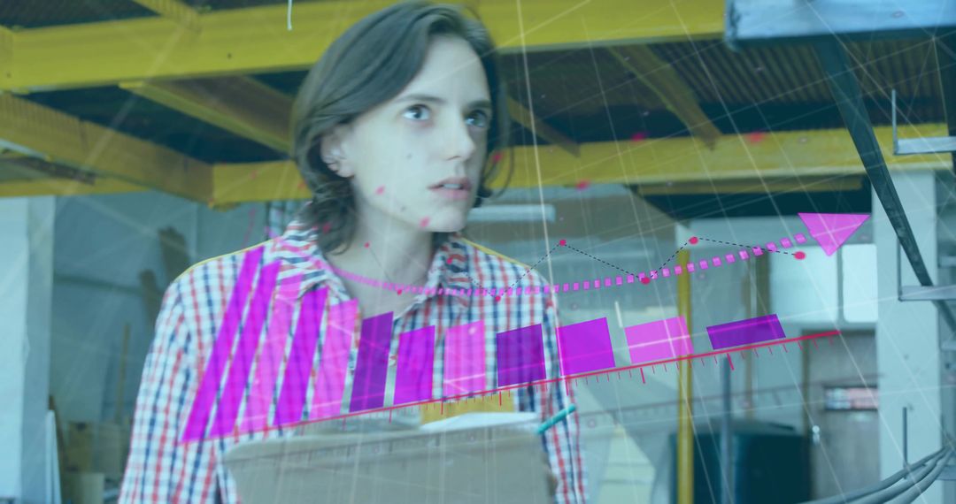 Woman in Warehouse with Augmented Reality Charts and Data Insights