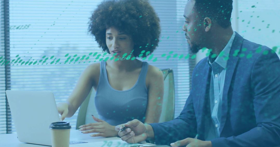 Diverse Professionals Collaborating on Laptop Project in Office