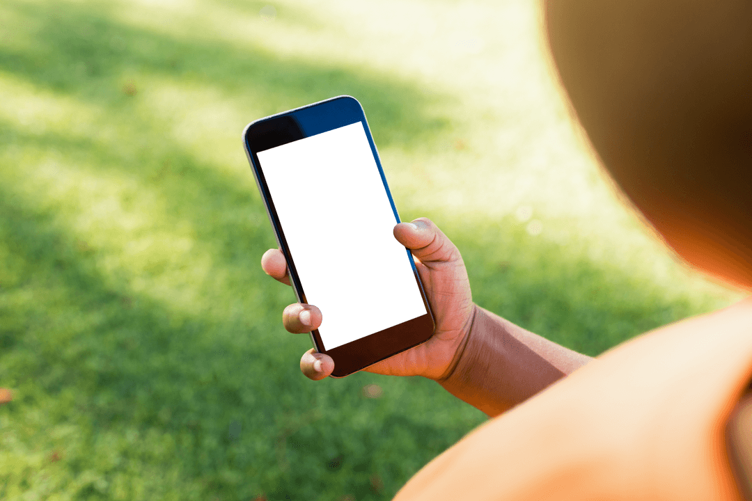 Child Holding Smartphone with Blank Screen in Park Setting