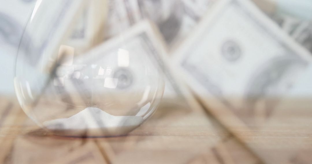 Time and Money Concept with Blurred Hourglass and Banknotes