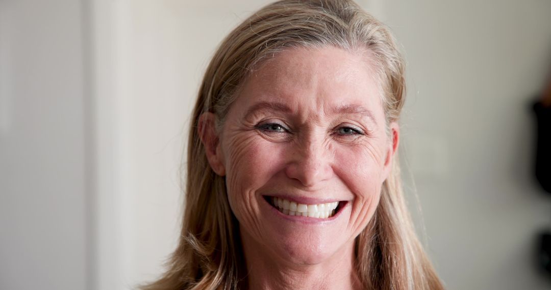 Happy Mature Woman Smiling, Showcasing Natural Beauty