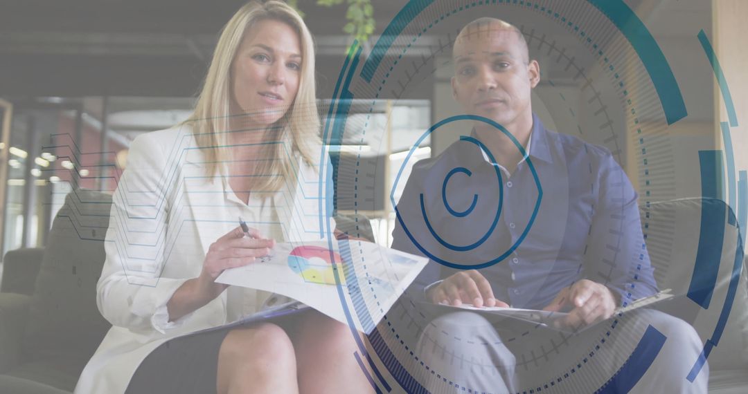 Business Professionals Analyzing Data in Modern Office Lounge