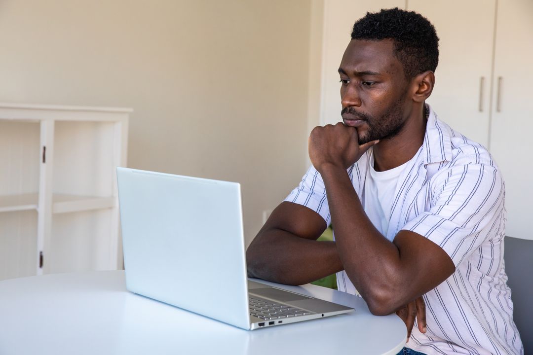 Focused Professional Contemplating at Work Desk