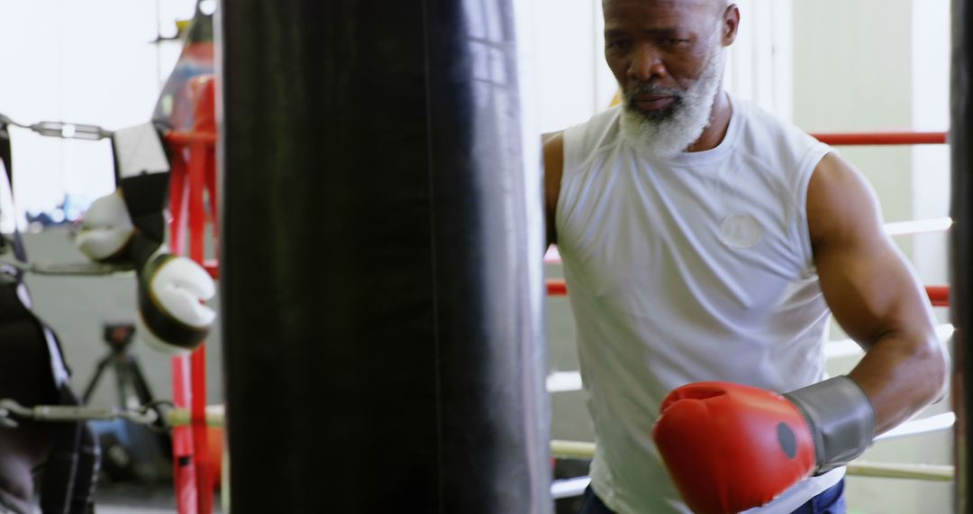 Senior African American Man Boxing Training in Gym - Free Images, Stock Photos and Pictures on Pikwizard.com