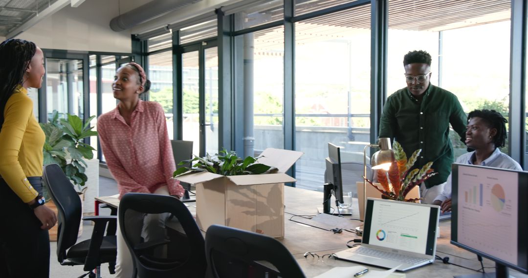 Team Celebrating Success in Bright Modern Office