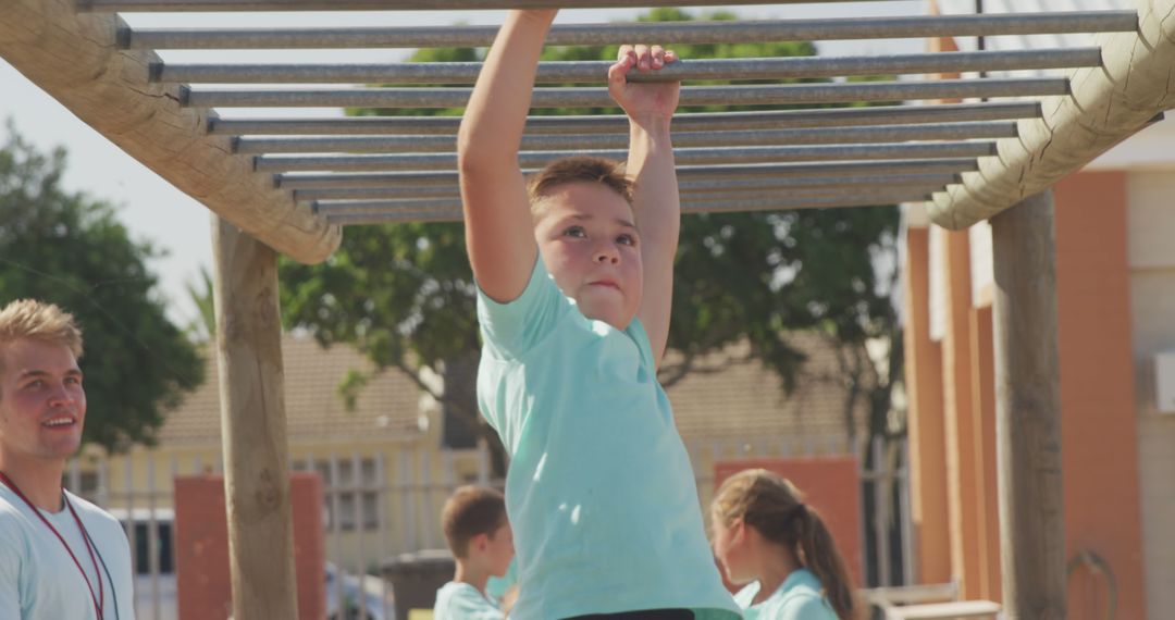 Boy Swinging on Monkey Bars at Playground - Free Images, Stock Photos and Pictures on Pikwizard.com