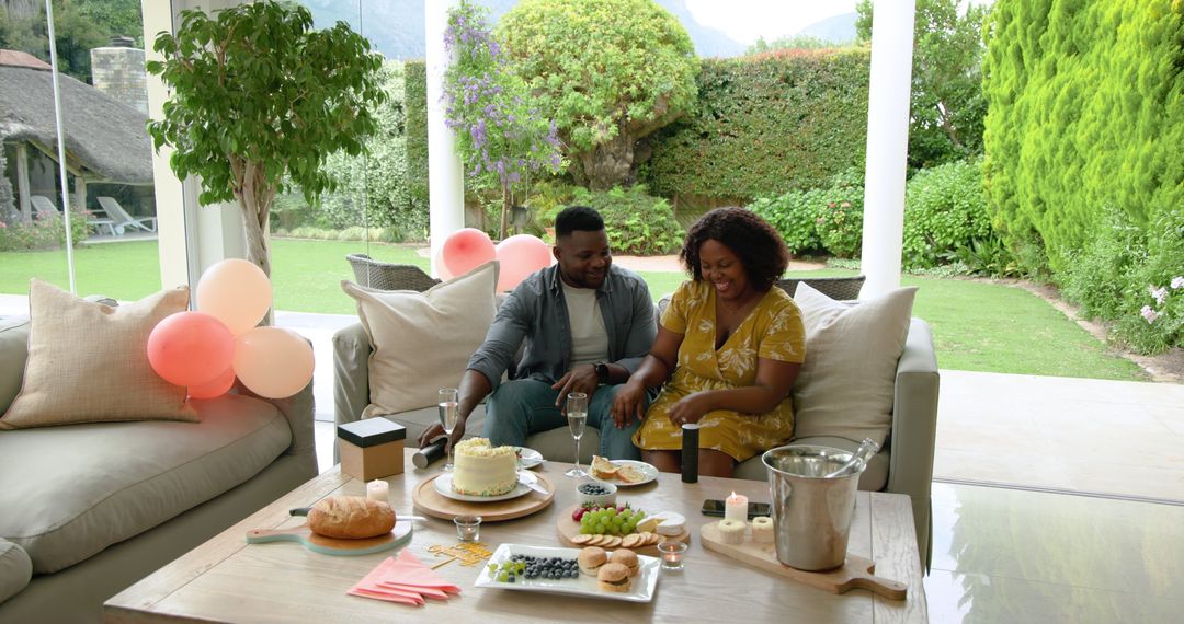 Celebrating at Home: Mature Couple Toasting with Champagne