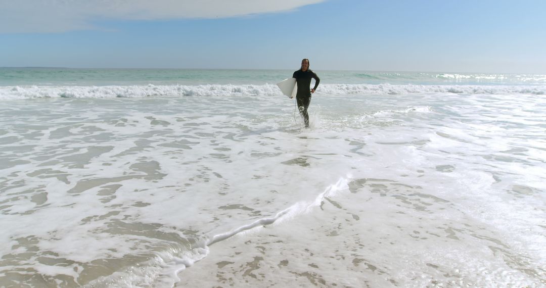 Surfer Running with Surfboard to Ocean Waves 4k - Free Images, Stock Photos and Pictures on Pikwizard.com