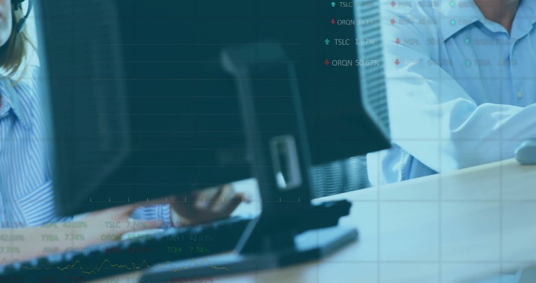 Business Team Analyzing Digital Data on Monitors