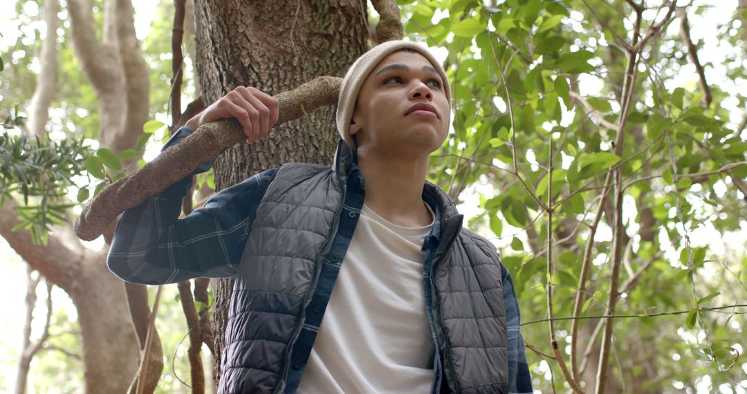 Young Adult Exploring Natural Forest with Thoughtful Expression