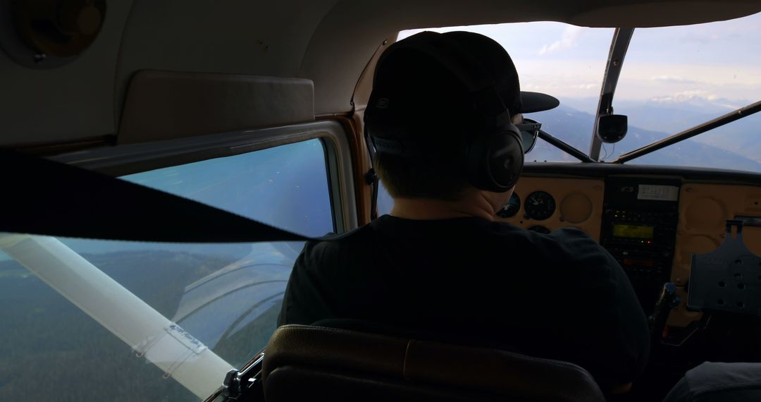 Pilot Controlling Light Aircraft in Clear Sky - Free Images, Stock Photos and Pictures on Pikwizard.com