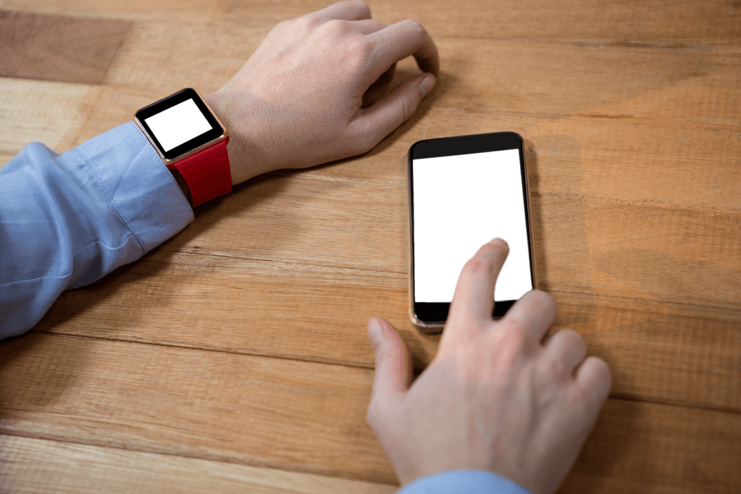 Transparent Smartphone Usage: Hand Interacting with Device on Wooden Desk