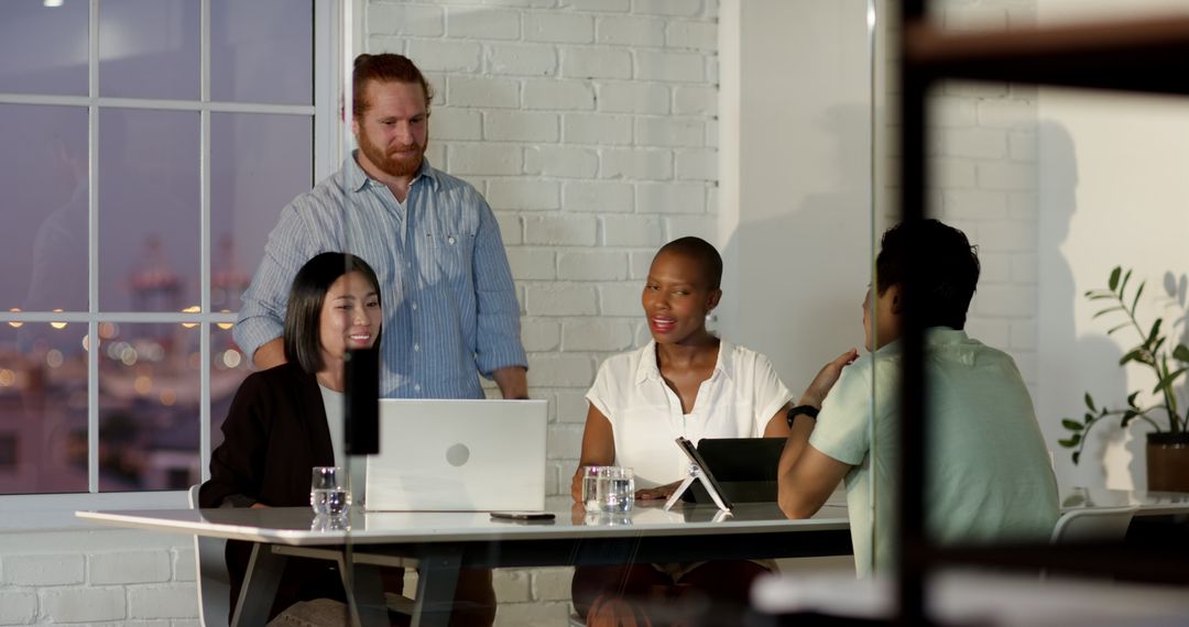 Diverse Team Collaborating on Business Project Around Office Table