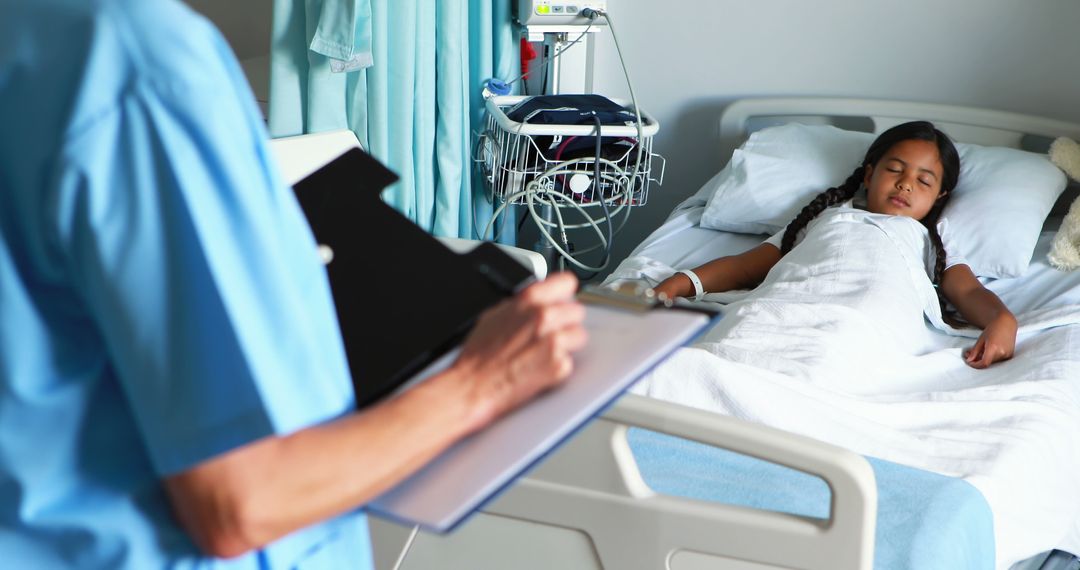 Doctor Checking Notes While Child Patient Resting in Hospital Bed - Free Images, Stock Photos and Pictures on Pikwizard.com